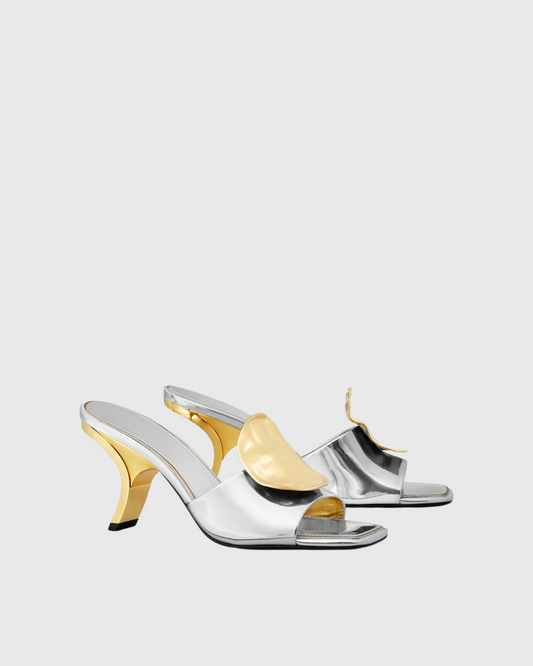 Sabra Metal Coin Asymmetrical Slippers In Silver