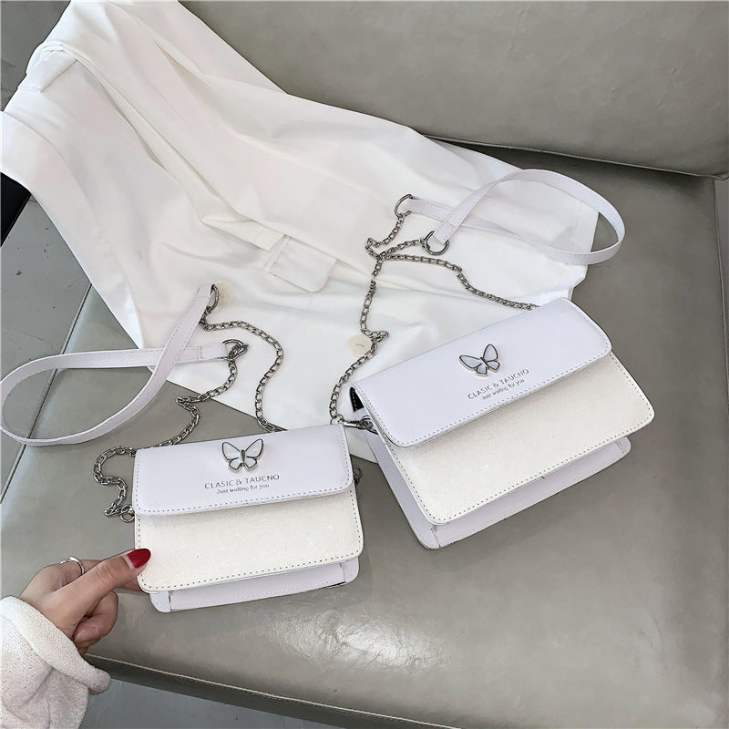 Sac à bandoulière en PU à rabat décoratif et papillon pour femme