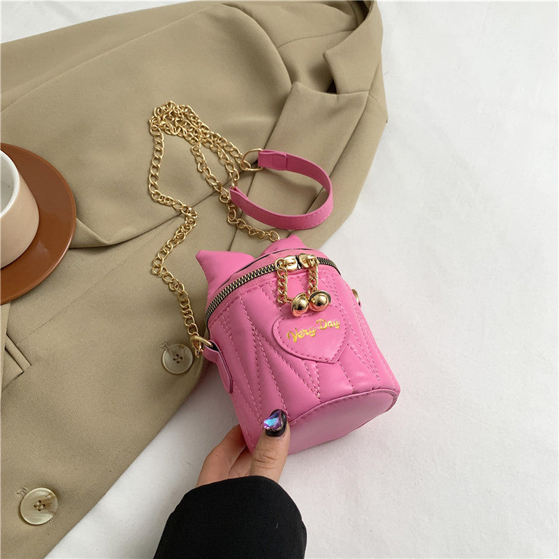 Mini sac à bandoulière cylindrique tendance et mignon avec fermeture éclair et nœud papillon de couleur unie