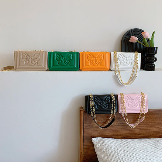 Sac à bandoulière carré tendance en relief avec motif papillon de couleur unie