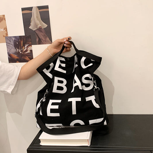 Sac à bandoulière en toile grande capacité pour femme, style décontracté, motif lettres