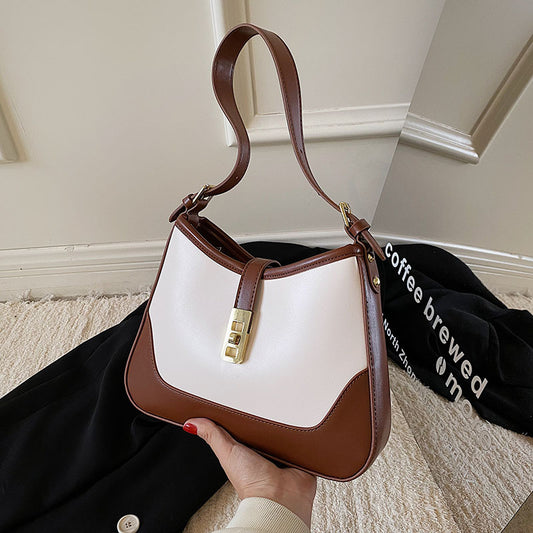 Sac à main tendance en cuir synthétique avec fermeture en métal et blocs de couleurs pour femme