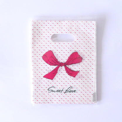 Lot de 100 sacs en plastique pour emballage cadeau, imprimés tendance 