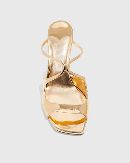Elvia Metallic Cross Sandals In Gold