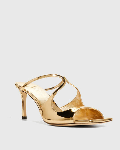 Elvia Metallic Cross Sandals In Gold