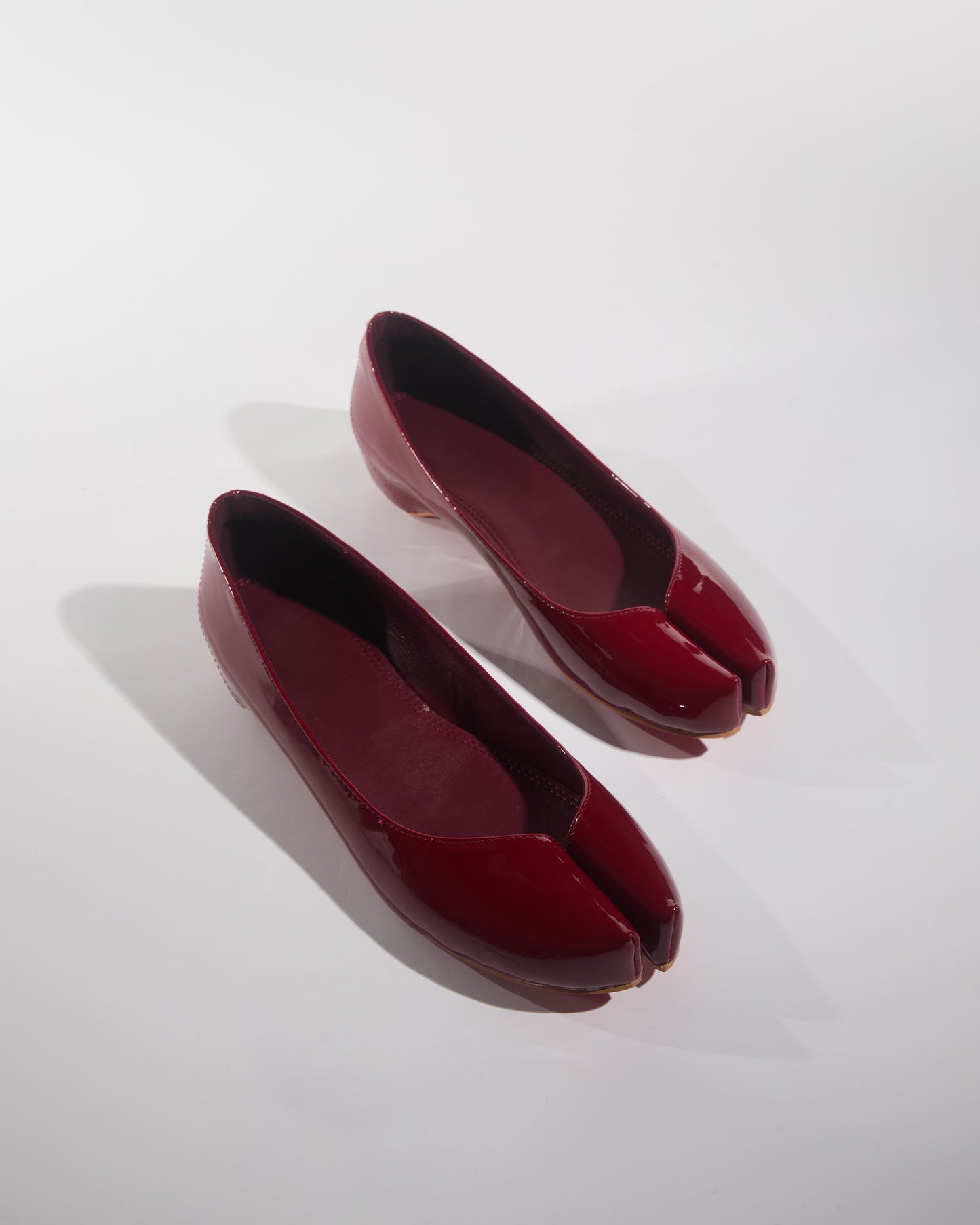 Fiore Patent Leather Tabi Pumps In Wine