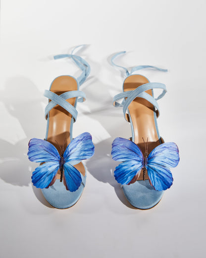 Io Butterfly Cross Strap Sandals In Blue