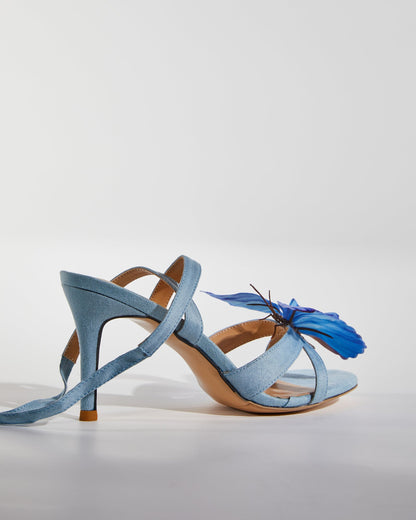 Io Butterfly Cross Strap Sandals In Blue