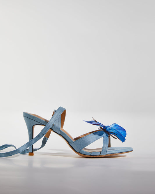 Io Butterfly Cross Strap Sandals In Blue