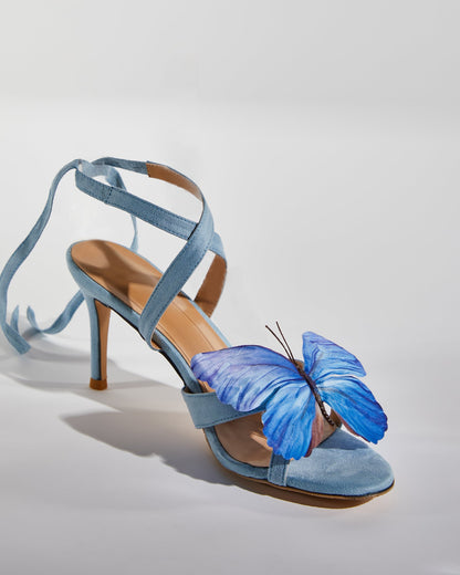 Io Butterfly Cross Strap Sandals In Blue