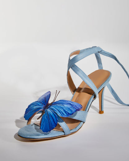 Io Butterfly Cross Strap Sandals In Blue