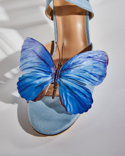 Io Butterfly Cross Strap Sandals In Blue