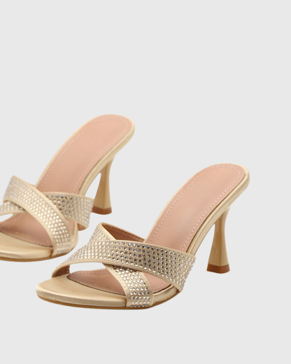 Natalina Rhinestone Cross Flared Heels In Gold