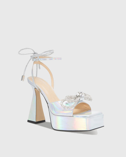 Rina Crystal Bow Lace Up Platform Flared Heels In Silver