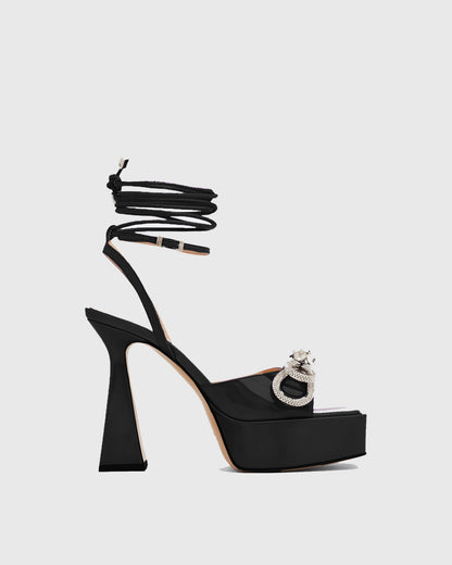 Rina Crystal Bow Lace Up Platform Flared Sandals In Black