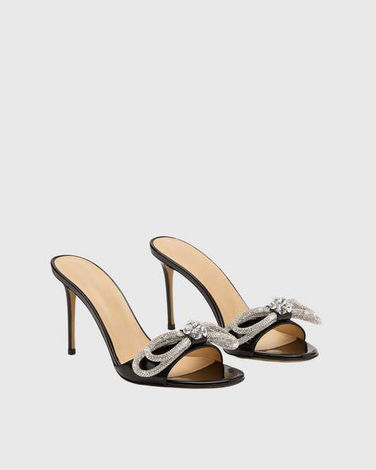 Rina Crystal Bow Patent Leather Mules In Black
