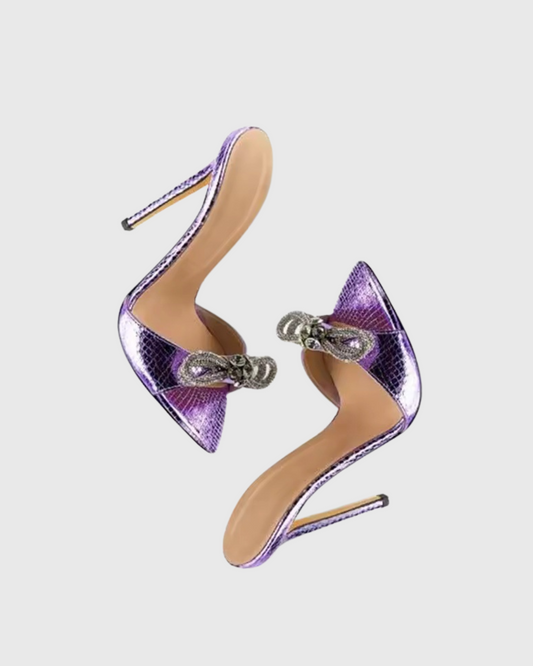 Rina Crystal Bow Snake Mules In Purple