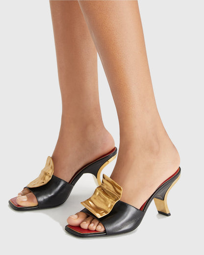 Sabra Metal Coin Asymmetrical Slippers In Black