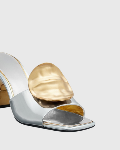 Sabra Metal Coin Asymmetrical Slippers In Silver