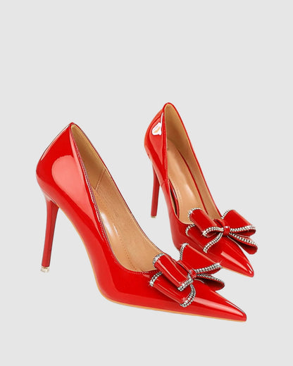 Zamora Rhinestone Bow Patent Leather Pumps In Red