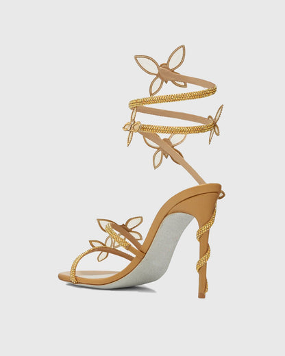 Zana Rhinestone Bow Snake Sandals In Gold