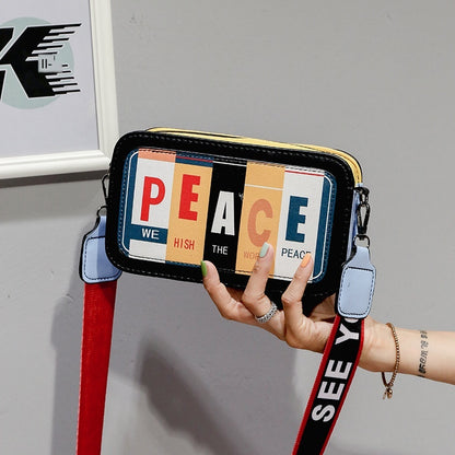 Sac à bandoulière en PU à motif de lettres tendance pour femme, fermeture éclair, blocage des couleurs 