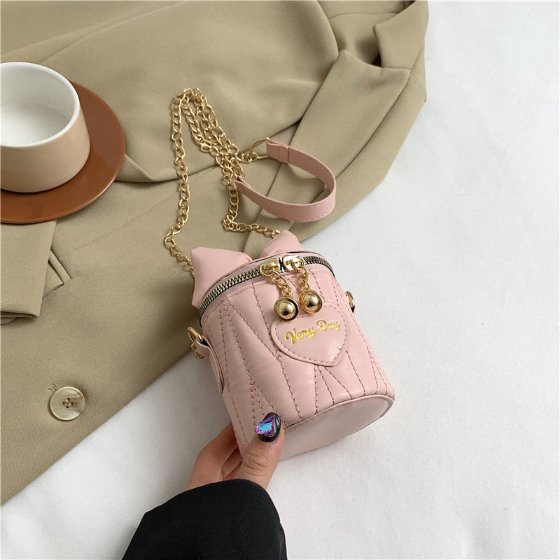 Mini sac à bandoulière cylindrique tendance et mignon avec fermeture éclair et nœud papillon de couleur unie 