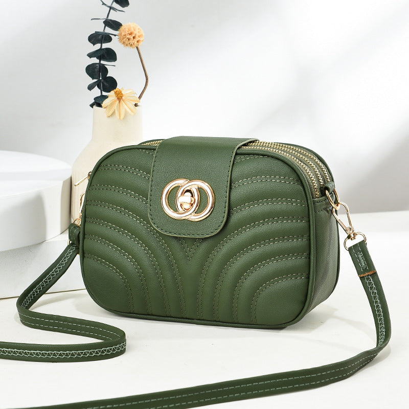 Sac à bandoulière en PU à trois couches avec fermeture éclair et broderie à rayures de couleur unie pour femme 