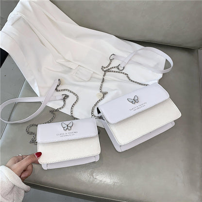 Sac à bandoulière en PU à rabat décoratif et papillon pour femme 