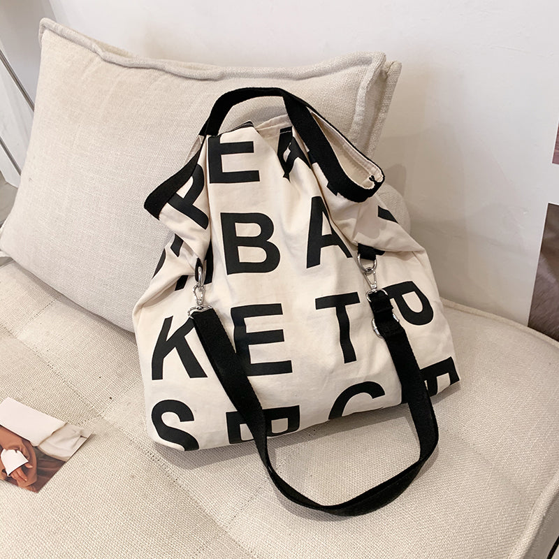 Sac à bandoulière en toile grande capacité pour femme, style décontracté, motif lettres 
