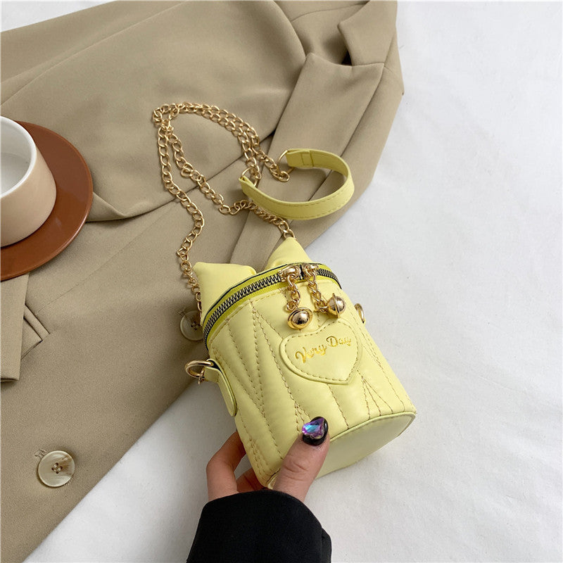 Mini sac à bandoulière cylindrique tendance et mignon avec fermeture éclair et nœud papillon de couleur unie 