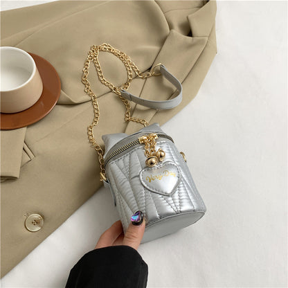 Mini sac à bandoulière cylindrique tendance et mignon avec fermeture éclair et nœud papillon de couleur unie 