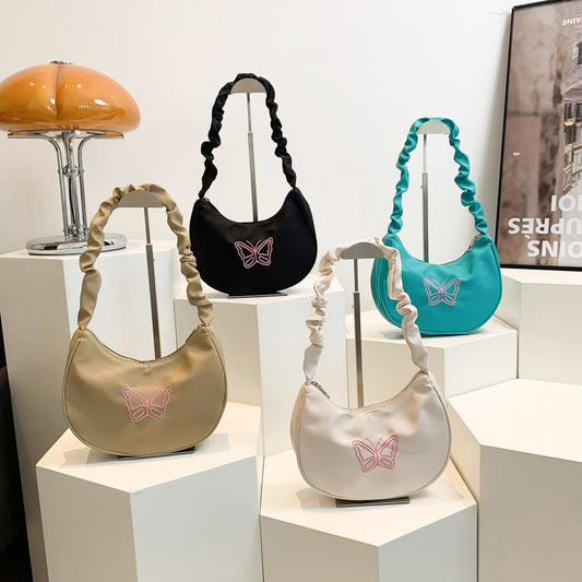 Sac sous les bras papillon au design minimaliste 