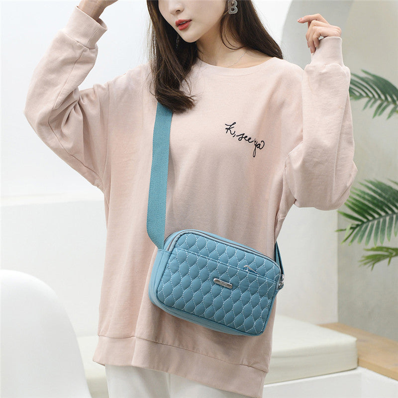 Sac bandoulière matelassé de couleur unie pour femme, style décontracté, avec coutures apparentes 