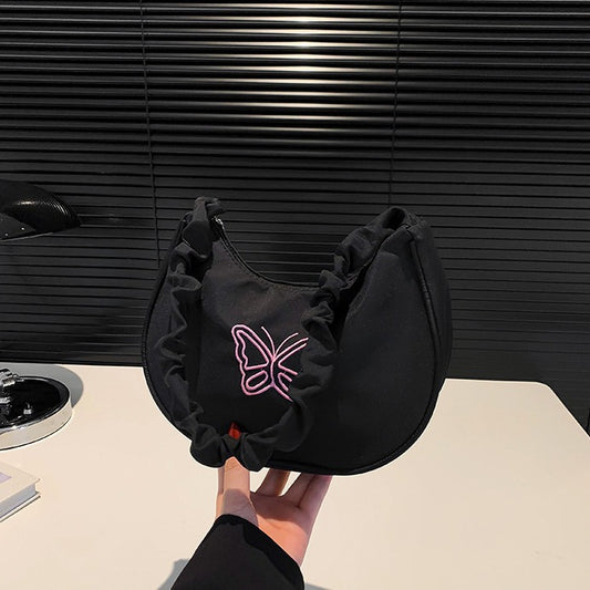 Sac sous les bras papillon au design minimaliste 