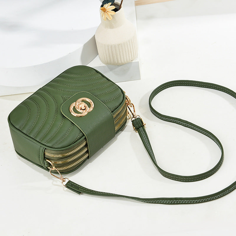 Sac à bandoulière en PU à trois couches avec fermeture éclair et broderie à rayures de couleur unie pour femme 