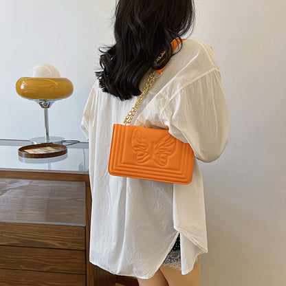 Sac à bandoulière carré tendance en relief avec motif papillon de couleur unie 