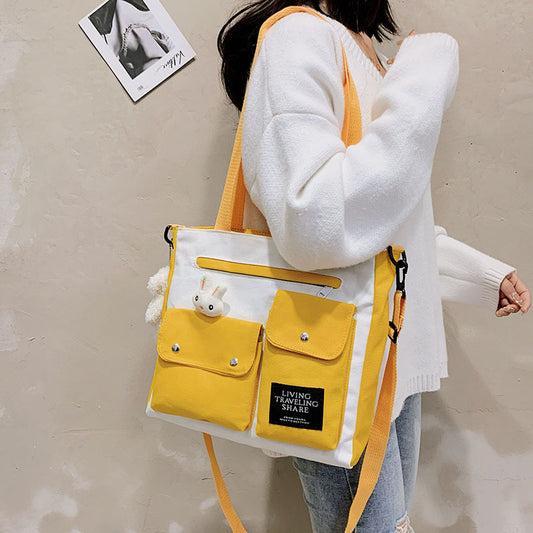 Sac à bandoulière en toile à motif de poupée de dessin animé pour femme, joli sac à bandoulière décoratif avec poche et blocage de couleurs 