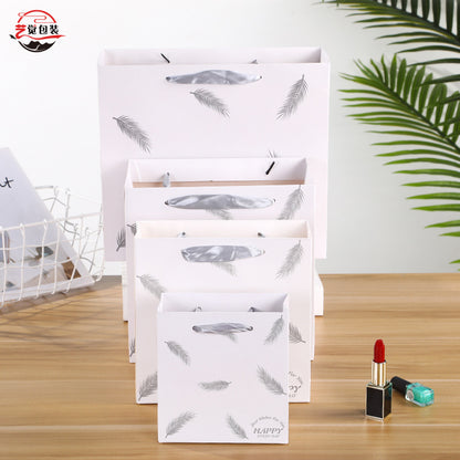 Sac en papier imprimé plumes tendance 