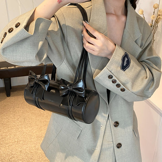 Sac à bandoulière cylindrique décoratif avec nœud décoratif et poignée zippée pour femme