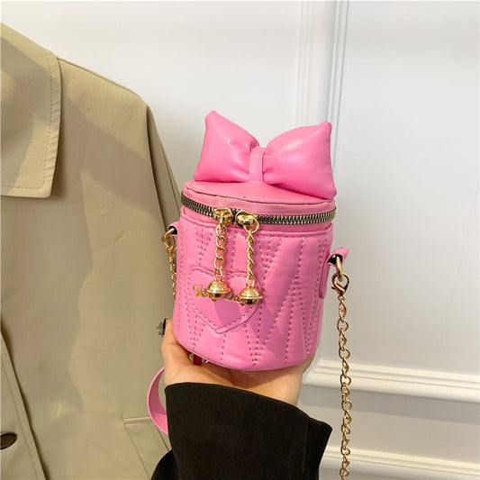 Mini sac à bandoulière cylindrique tendance et mignon avec fermeture éclair et nœud papillon de couleur unie 