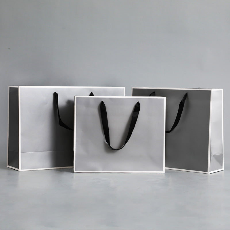 Sac d'emballage en papier gris argenté, simple et portable 