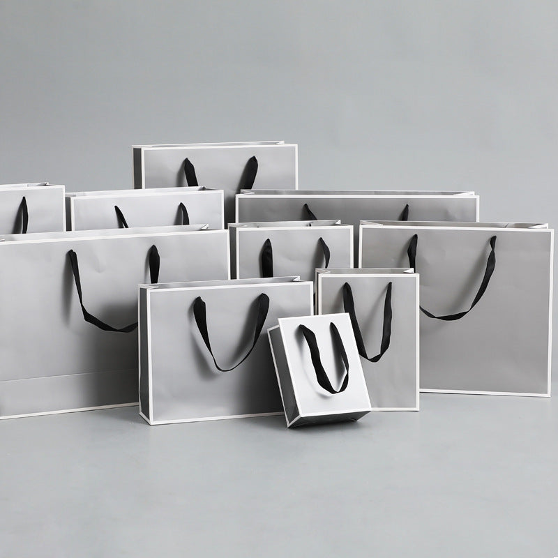 Sac d'emballage en papier gris argenté, simple et portable 