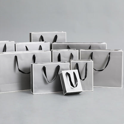 Sac d'emballage en papier gris argenté, simple et portable 