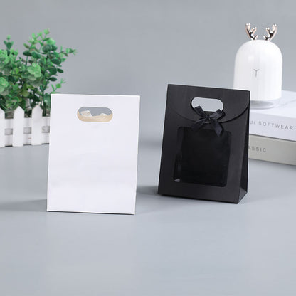 Sac cadeau transparent à rabat avec nœud créatif et simple 