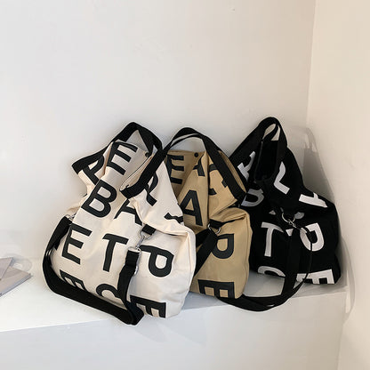 Sac à bandoulière en toile grande capacité pour femme, style décontracté, motif lettres 