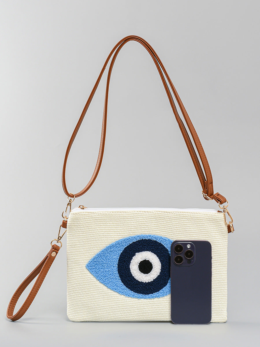 Sac à bandoulière en toile brodée en peluche avec motif mauvais œil tendance 