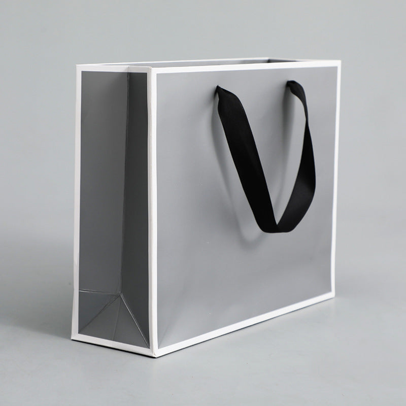 Sac d'emballage en papier gris argenté, simple et portable 