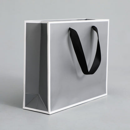 Sac d'emballage en papier gris argenté, simple et portable 